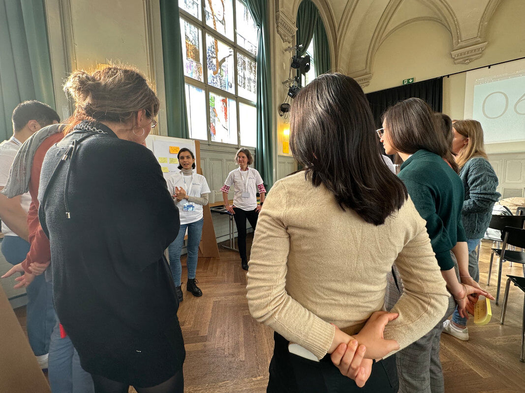 Participants in a discussion circle at Bits to Breakthroughs 2023